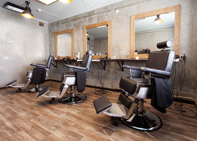 58154031 - hairdressing salon.three workplaces for barbers, armchairs and mirrors